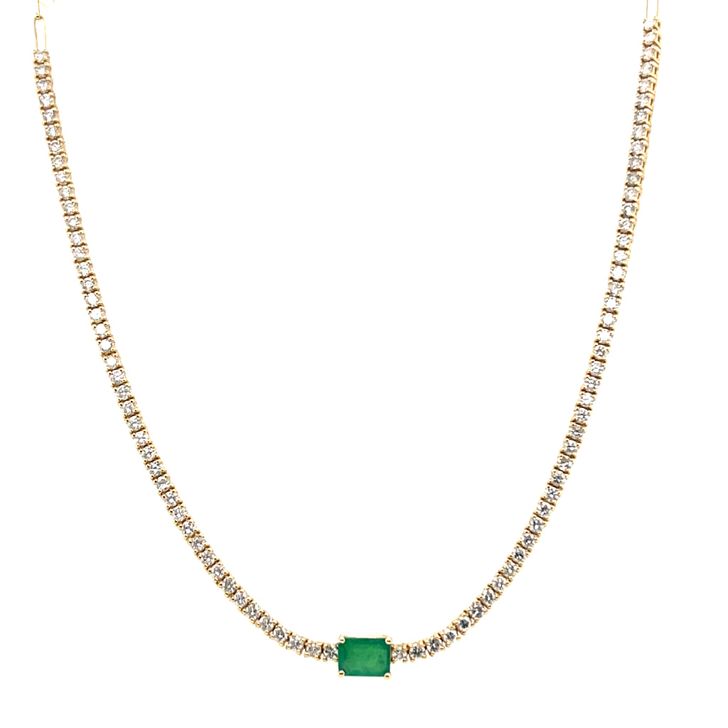 Tennis necklace with emerald centerpiece